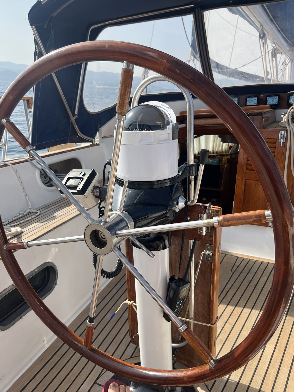 The wheel and binnacle aboard Gran Blau, freshly overhauled