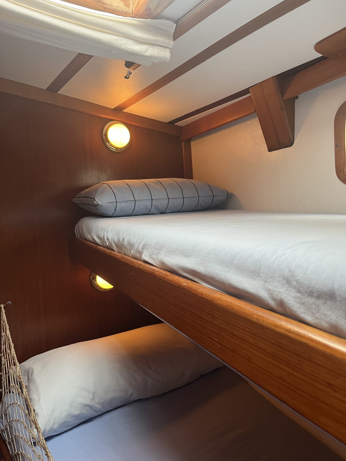 A cabin corner aboard Gran Blau, warmly lit