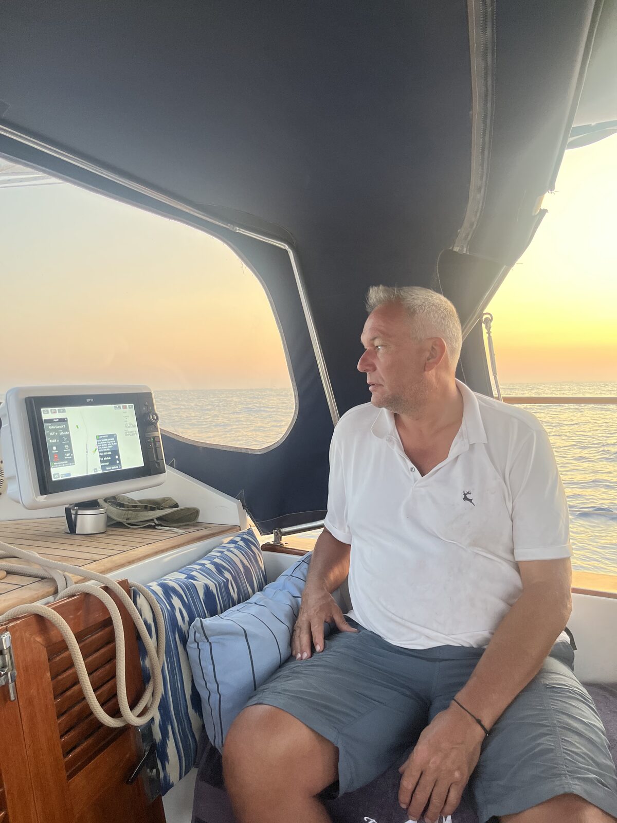 Checking the course at sunset aboard Gran Blau