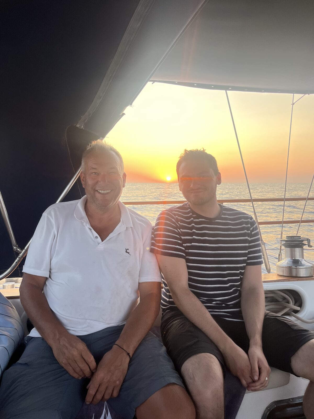 Crew aboard Gran Blau at sunset