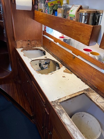 Wider view of the galley worktop stripped back during the rebuild