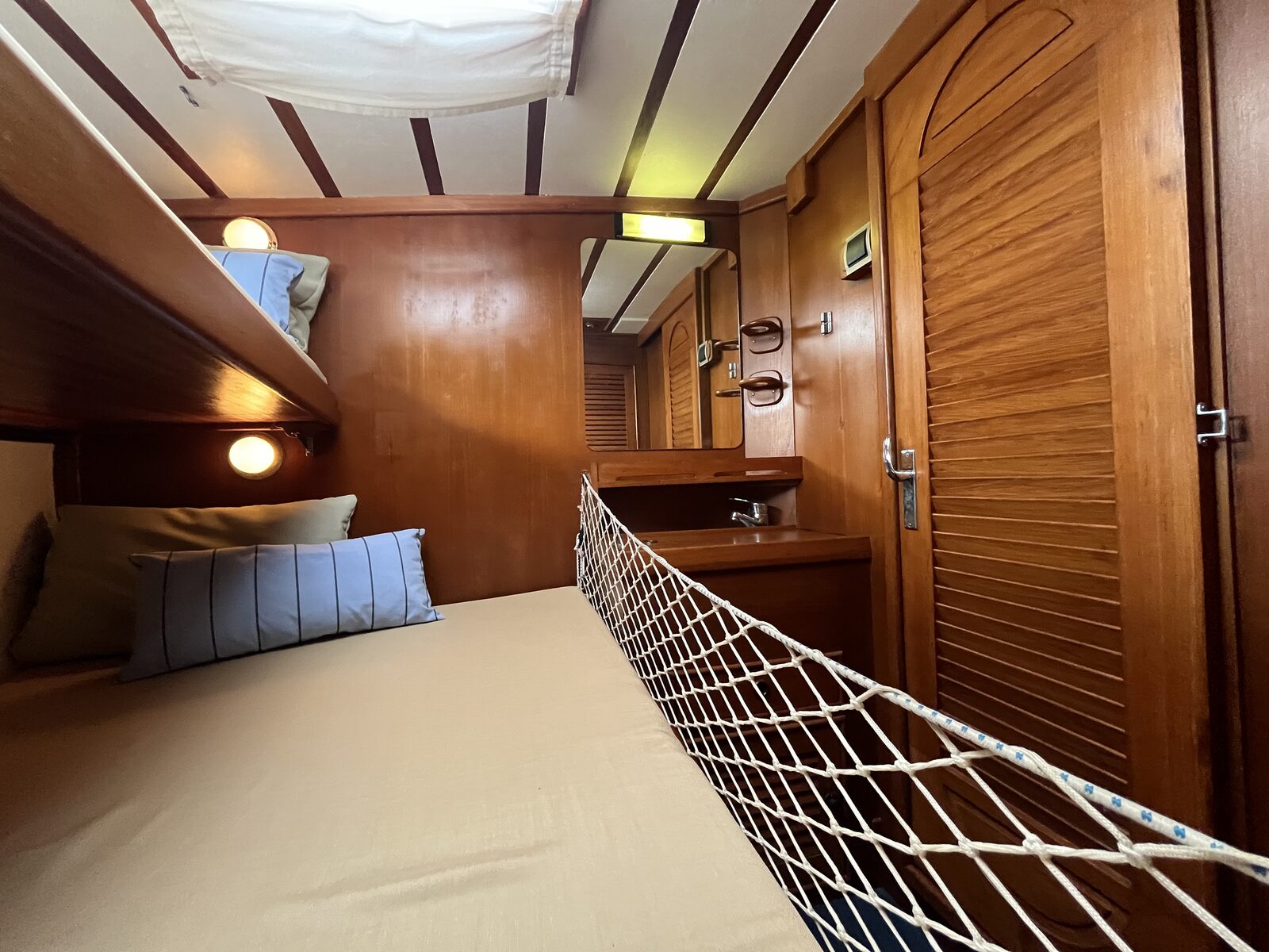 One of the guest cabins aboard Gran Blau, with twin bunks