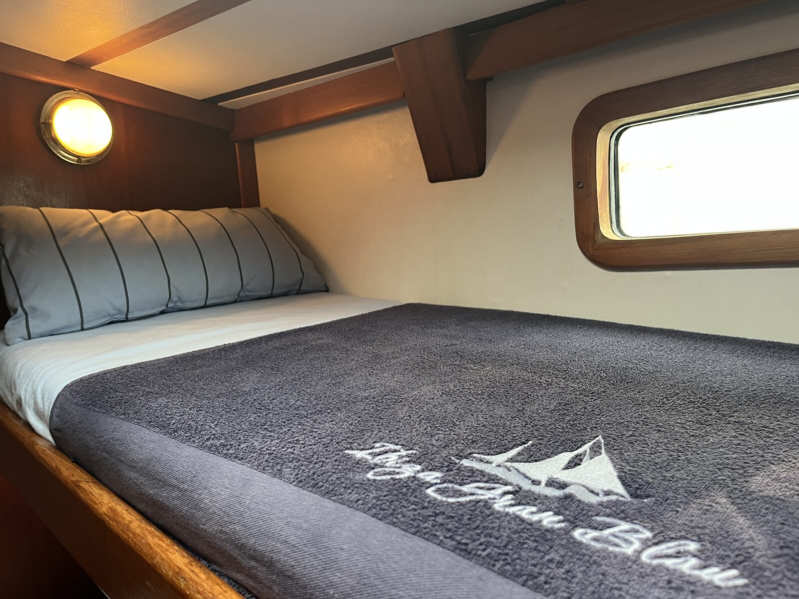 A Gran Blau branded towel in a guest cabin