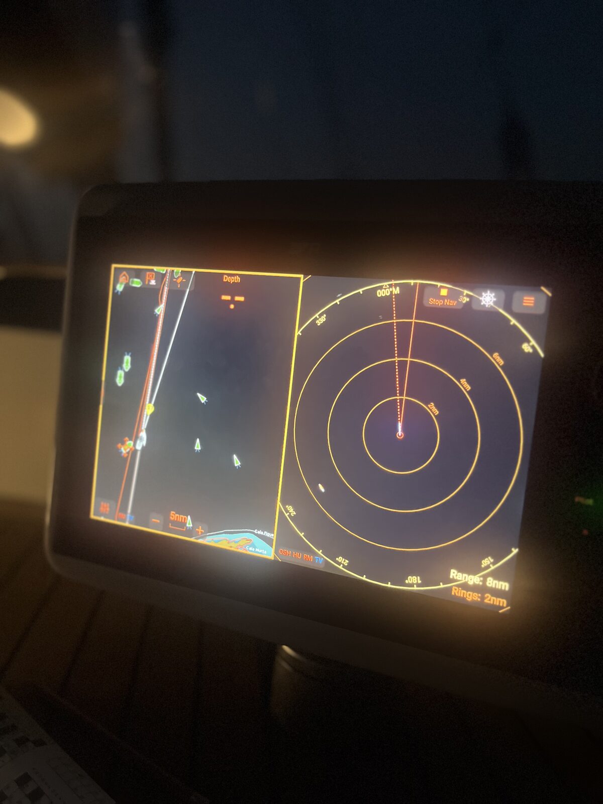 Raymarine radar and chartplotter showing AIS targets at night aboard Gran Blau